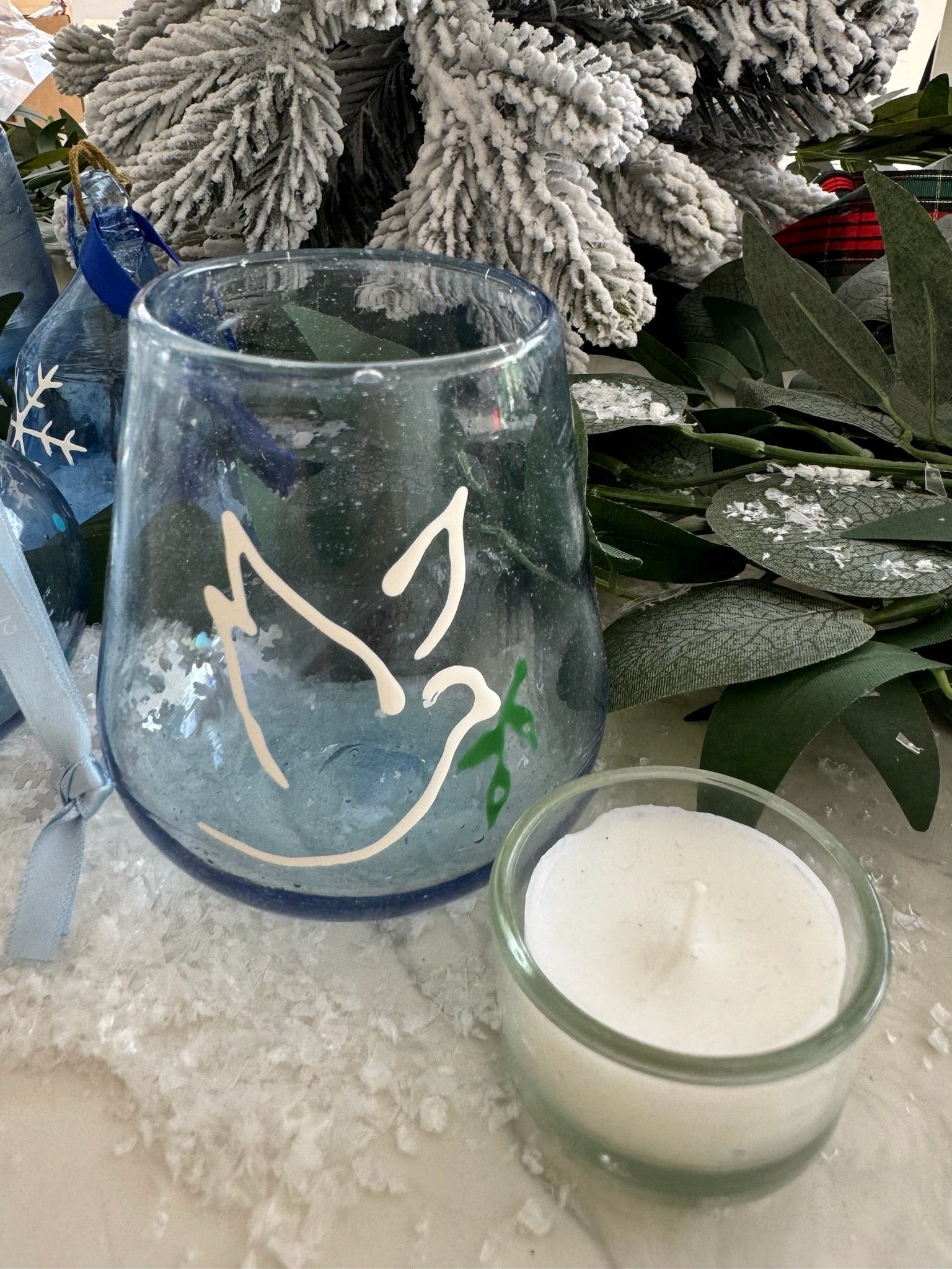 Decorative glass peace light with a dove and olive branch design made in Bethlehem