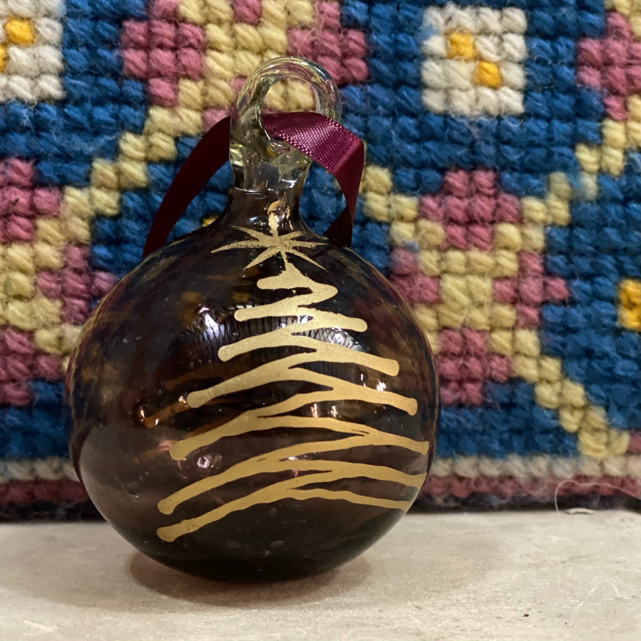 Burgundy glass bauble with gold Christmas tree