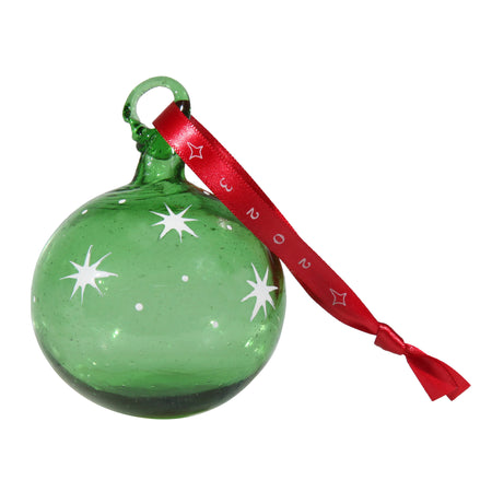 Close-up view of Green Christmas ornament with white stars