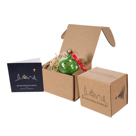 Packaging of Green Christmas ornament with white stars